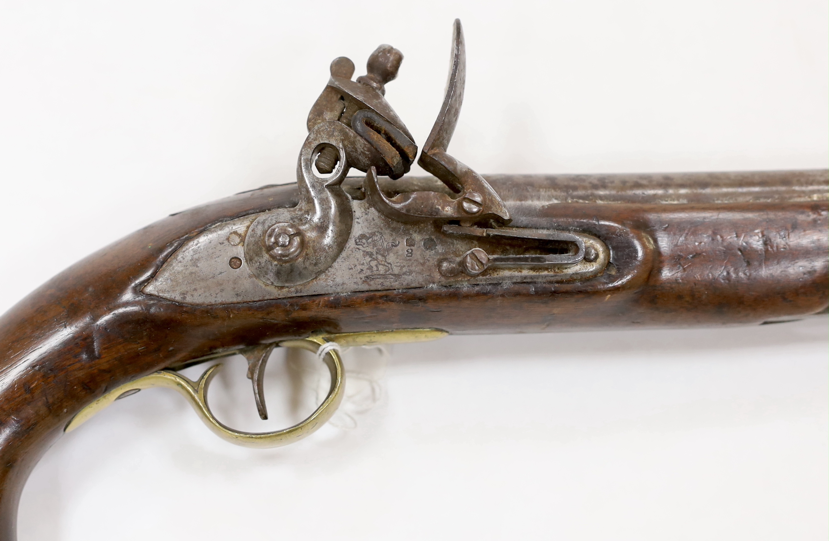 A 16 bore East India Company flintlock pistol, 9” barrel, London proof marks, regulation brass mounts and lock with EIC lion rampant, and fitted with iron lanyard with swivel ram rod